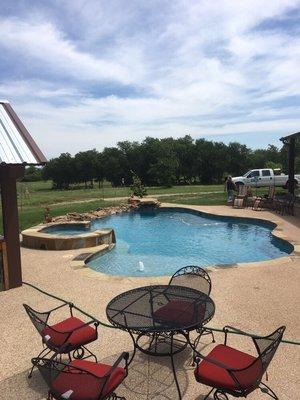 Cloud pool with tanning ledge and spa.