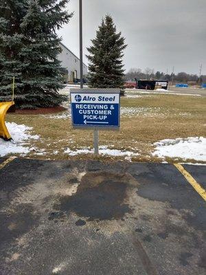 Go straight past this sign for receiving and customer pick-up.  Don't turn left when you see the sign!