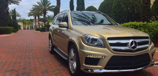 Mercedes-Benz GL550 SUV. Twin Turbo V8 Performance! AMG Package. ELEGANT Gold Custom Exterioir and Custom Walnut Wood Inside From $229 a Day