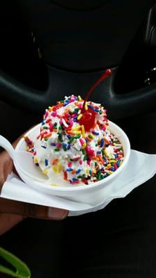 Hot caramel sundae with rainbow sprinkles. Yum!