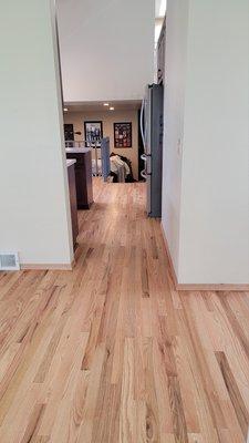 In the foreground is the dining room (was previously carpet) and in the distance is the breakfast nook.