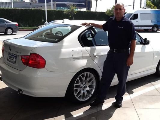 Gozalo proudly posing next to my totally refinished BMW!