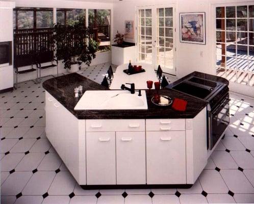 This island is situated in is a kitchen that is 27ft by 27ft. One of the few square kitchens that we have run across.