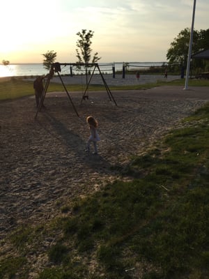 On the swings at the beach