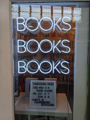 Picture of neon that says "BOOKS BOOKS BOOKS"