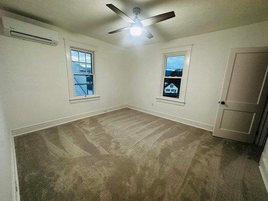 This is the master bedroom in a home w/ new carpet and a 4 unit mini split install.