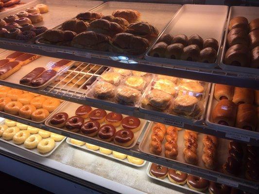 Donut case. Mostly glazed varieties and some breakfast sandwiches.