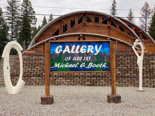 The unique Gallery with Quonset roof and logs was designed and built by the artist Michael Booth.