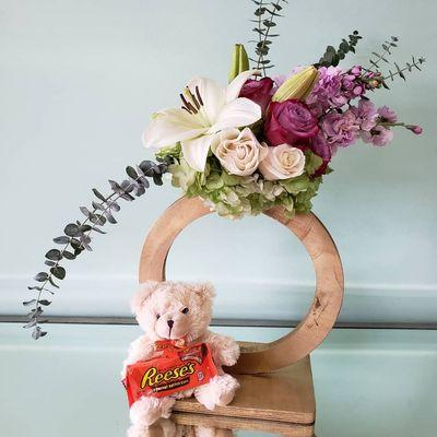 Floral arrangement with soft animals