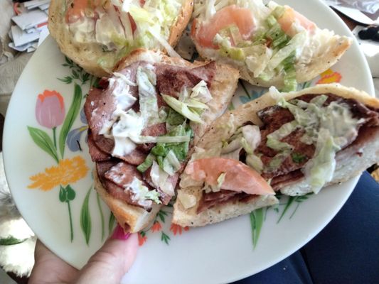 Taylor ham lettuce tomato onion and mayonnaise on and everything bagel