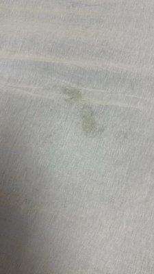 Imprint from bandaid on clean sheet