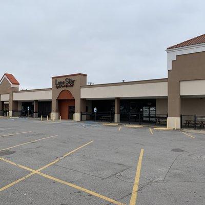 Parking lot and building for Lone Star Bar.