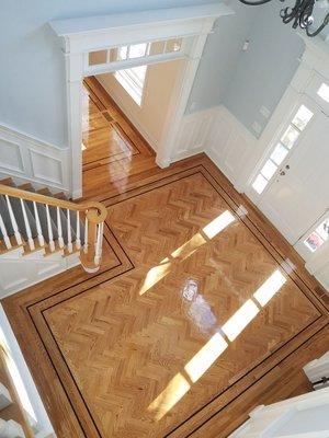 This is a photo of a herringbone installation wood Peruvian Walnut borders.