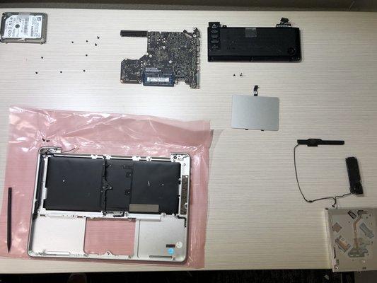 Tearing down a MacBook Pro for full case replacement.