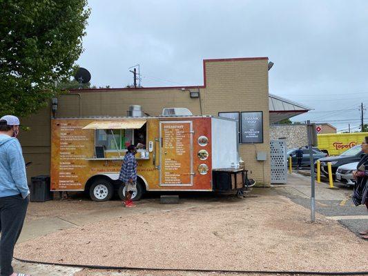 Taco truck next to Chevron