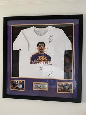 Framed shirt and photos with windows