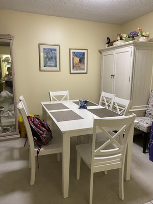 Lovely seating area with additional chairs throughout the condo.