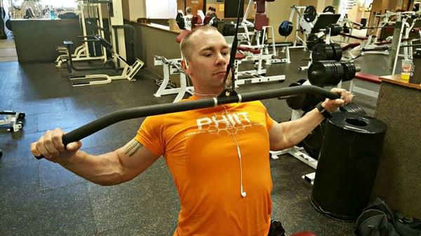 Working out back with wide grip pull downs.