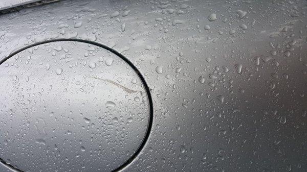 Keyed fuel door before repair.