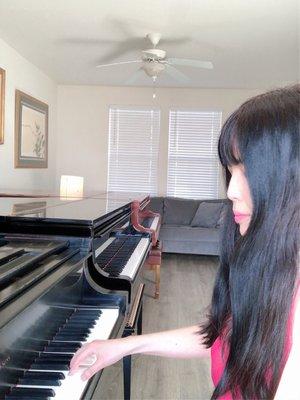 Playing Steinway model L piano