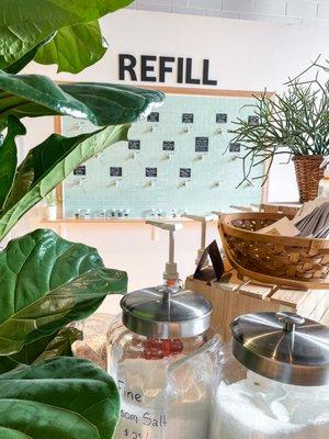 Our refill wall boasts a variety of cleaning products and organic, vegan-friendly castile soaps.