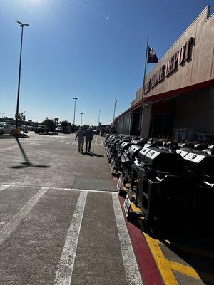 Home Depot associate assisting elderly gentleman to his vehicle