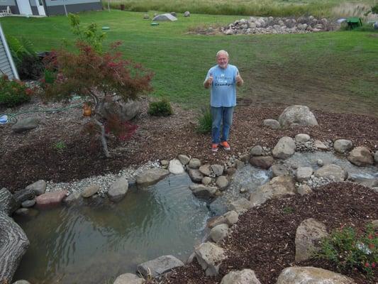 Roger and Ellen Weaver love their new pond and waterfalls!   Installed by  Premiere Aquascapes.