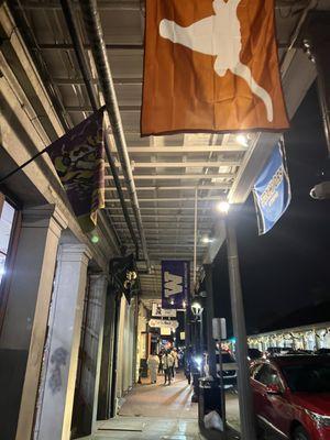 Walking to a restaurant in the French Quarter to pick up an order.