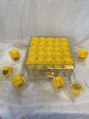 Acrylic boxes hold up to 25 roses