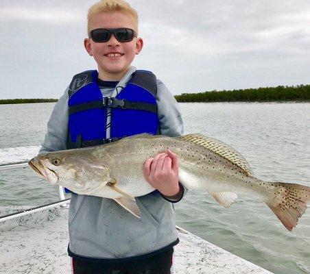 Happy Boy with monster speckled trout