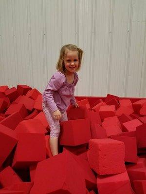 Playing in the foam blocks on a rainy day.