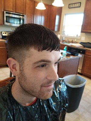 My husband's haircut that he received from Sport Clips Haircuts of Greenwood Springs. This was taken just BEFORE we fixed it at home.