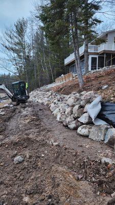 Boulder stone sea wall install