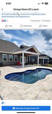 Fiberglass pool with travertine deck