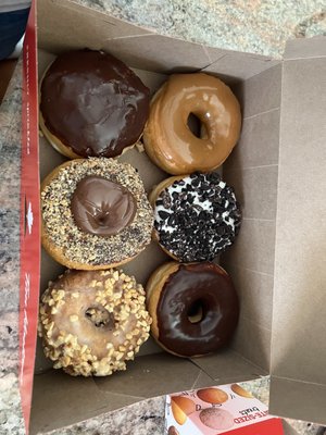 Maple dipped , Oreo, chocolate dipped, Boston cream, Nutella and peanut crunch