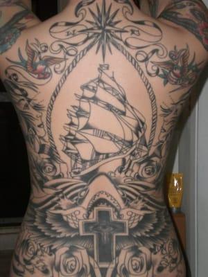 The birds were done previously and the cross was a cover up