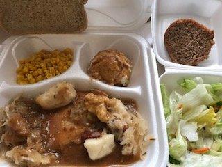 All for 11 dollars.....Pork with dumplings, sauerkraut, mashed potato and gravy, corn, salad and spice cake.