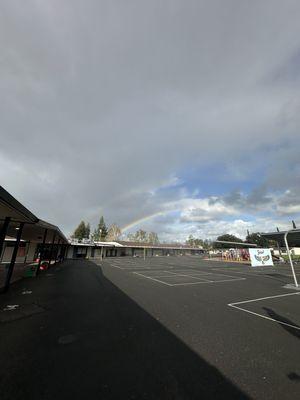 School campus with double rainbow