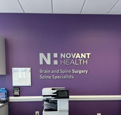 Front desk sign at Novant Health Spine Specialists