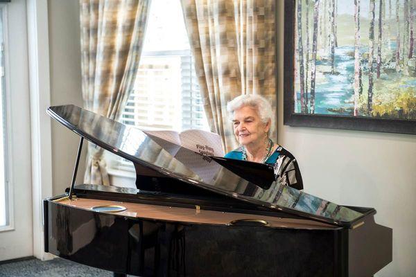 Dominion Senior Living of Florence | resident at piano