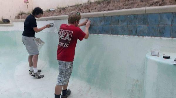 Swimming pool remodel my step son and I setting new tile