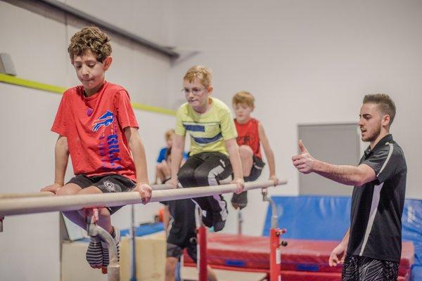 Boys' class on parallel bars