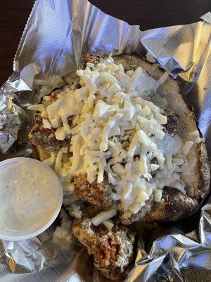 Garlic Parmesan Loaded Baked potato with breaded chicken chunks