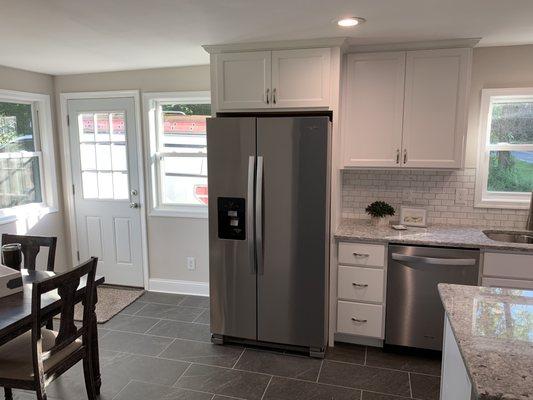 Reconfigured kitchen with new appliances, cabinets, granite, flooring & backsplash