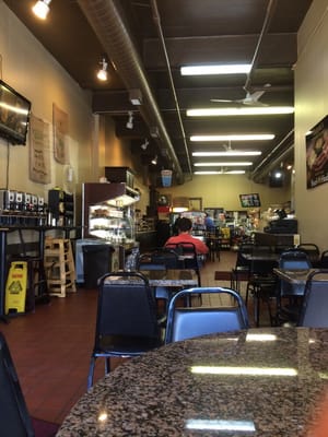 A pretty large space with long deli counter, eight tables and a communal counter space.