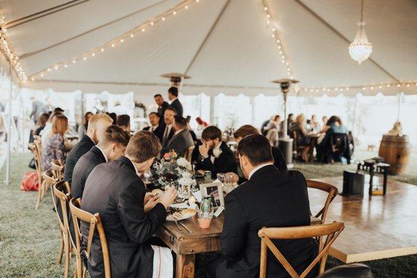 tent, heater, cross back chairs and handmade tables