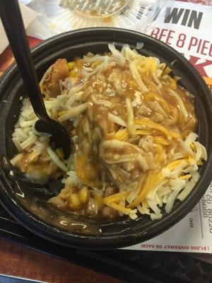 This is the mashed potatoes with gravy, cheese, corn, and chicken bowl!