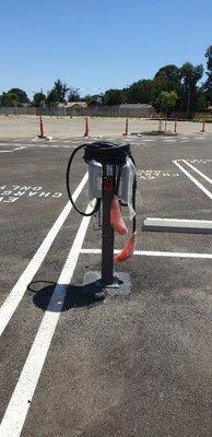 Installation of EV charger station in a commercial parking lot.