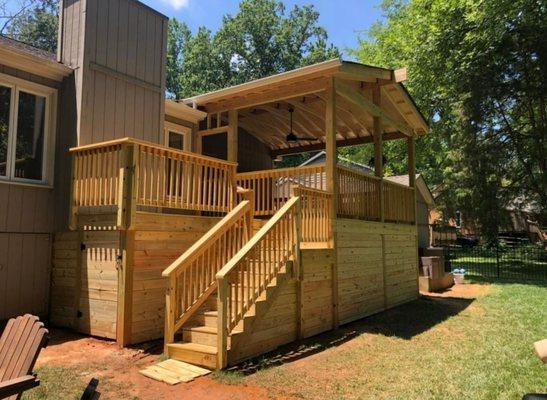 Looking to entertain, check out this covered deck with a custom grilling section!