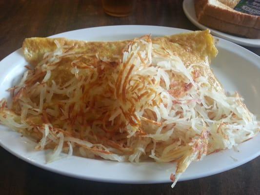 Sausage and cheese omelet with hashbrowns.